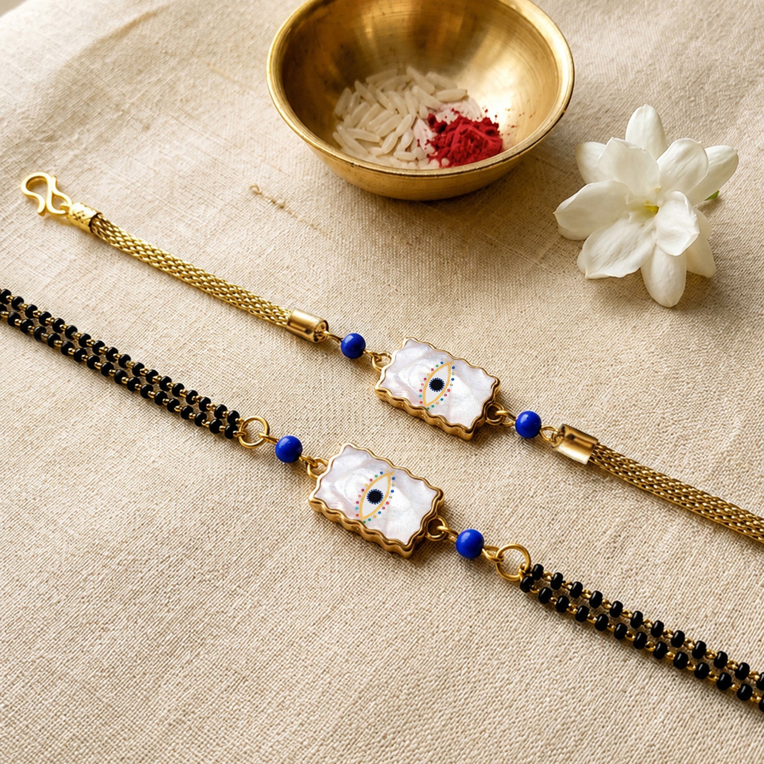 Artklim Elegant Minimal Evil Eye Bhaiya Bhabhi Rakhi Set with Pearl Tassels