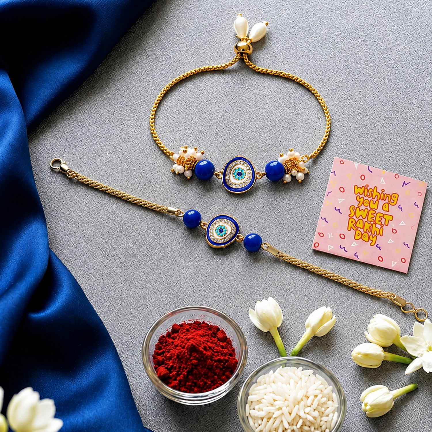 Artklim Blue Evil Eye Bhaiya Bhabhi Rakhi Set with Pearl Tassels