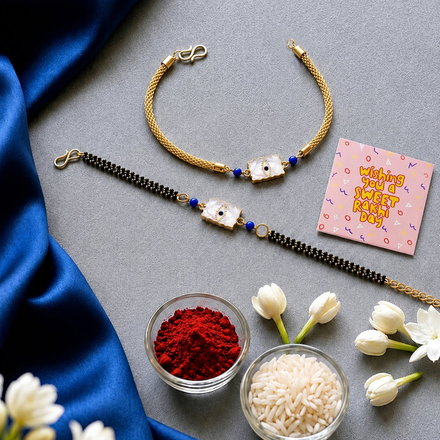 Artklim Elegant Minimal Evil Eye Bhaiya Bhabhi Rakhi Set with Pearl Tassels