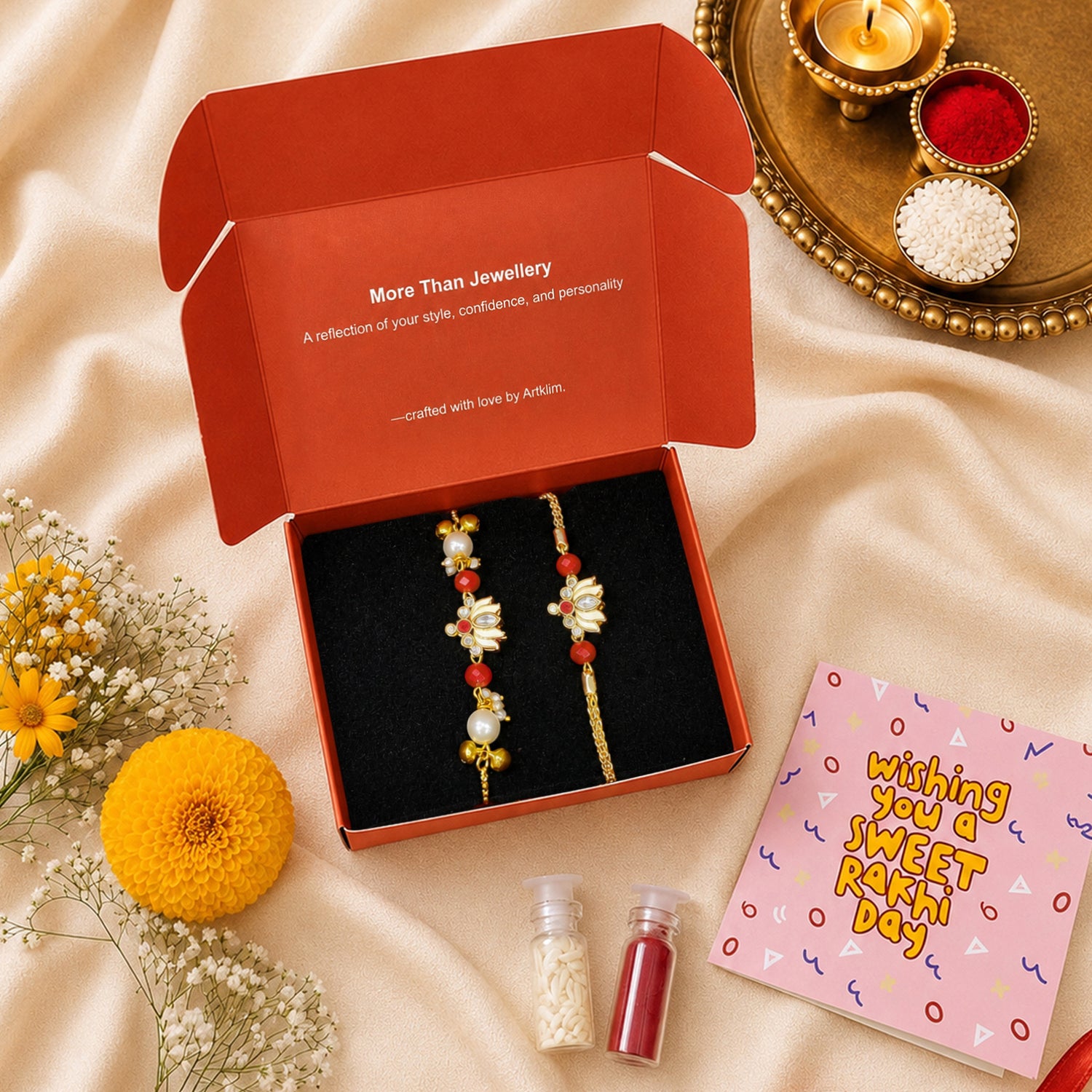 Artklim Gold-Plated Lotus Bhaiya Bhabhi Rakhi Set with Red Beads