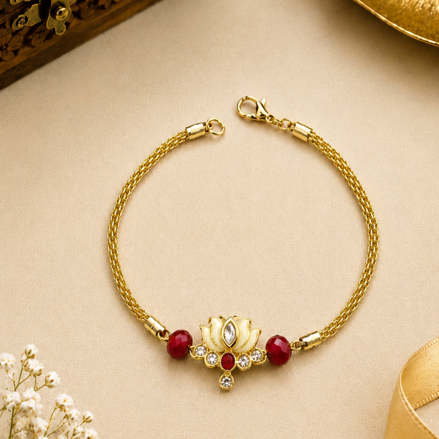 Artklim Gold-Plated Lotus Bhaiya Bhabhi Rakhi Set with Red Beads