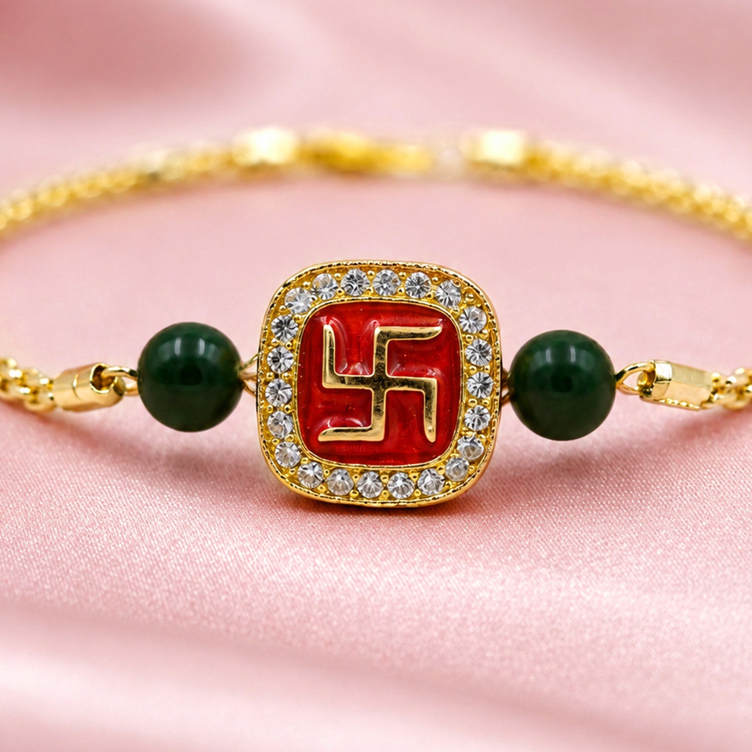Artklim Gold-Tone Swastik Designer Rakhi with Green Beads