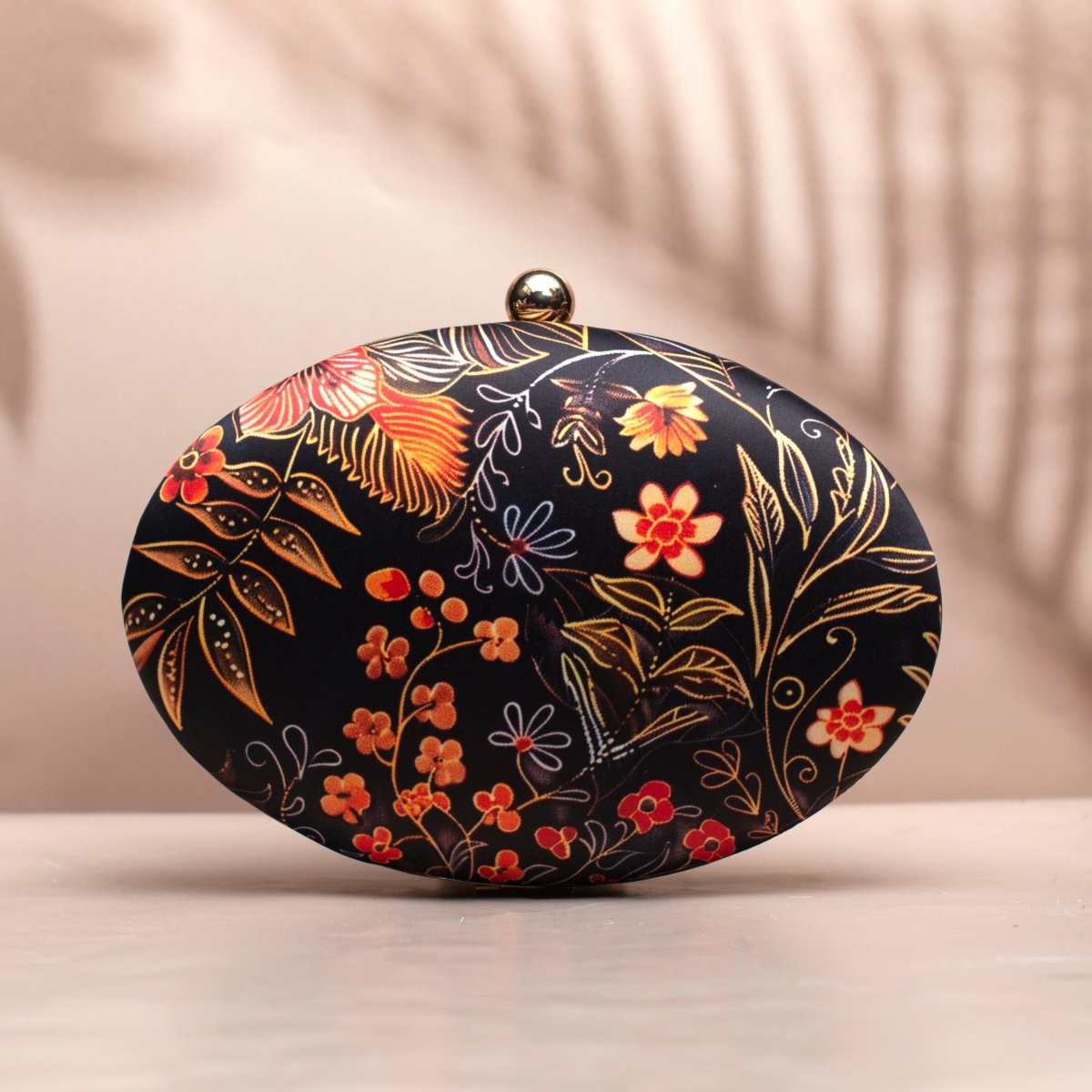 Orange Floral And Leaves Printed Oval Clutch