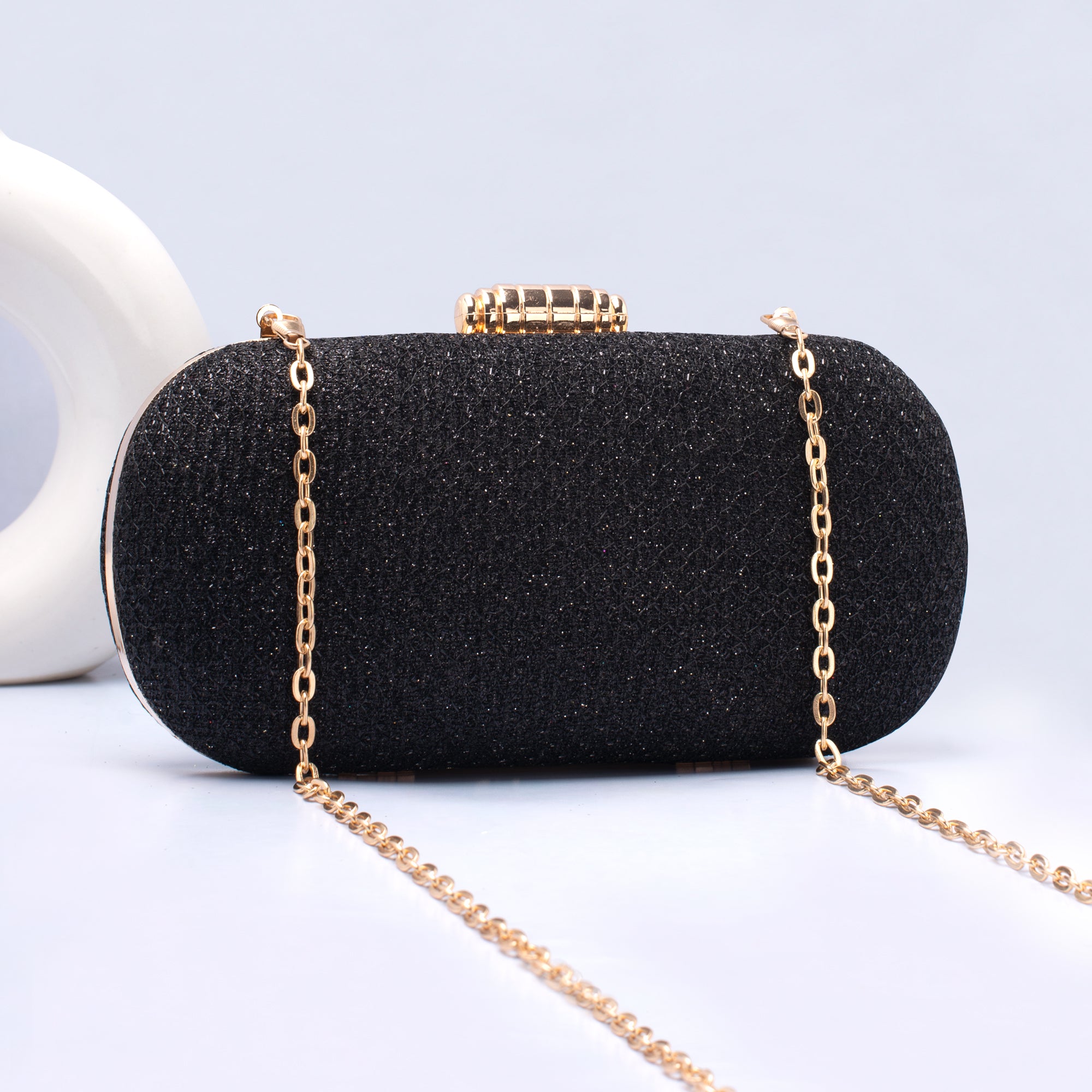 Artklim Black Based Shiny Fabric Capsule Shaped Clutch