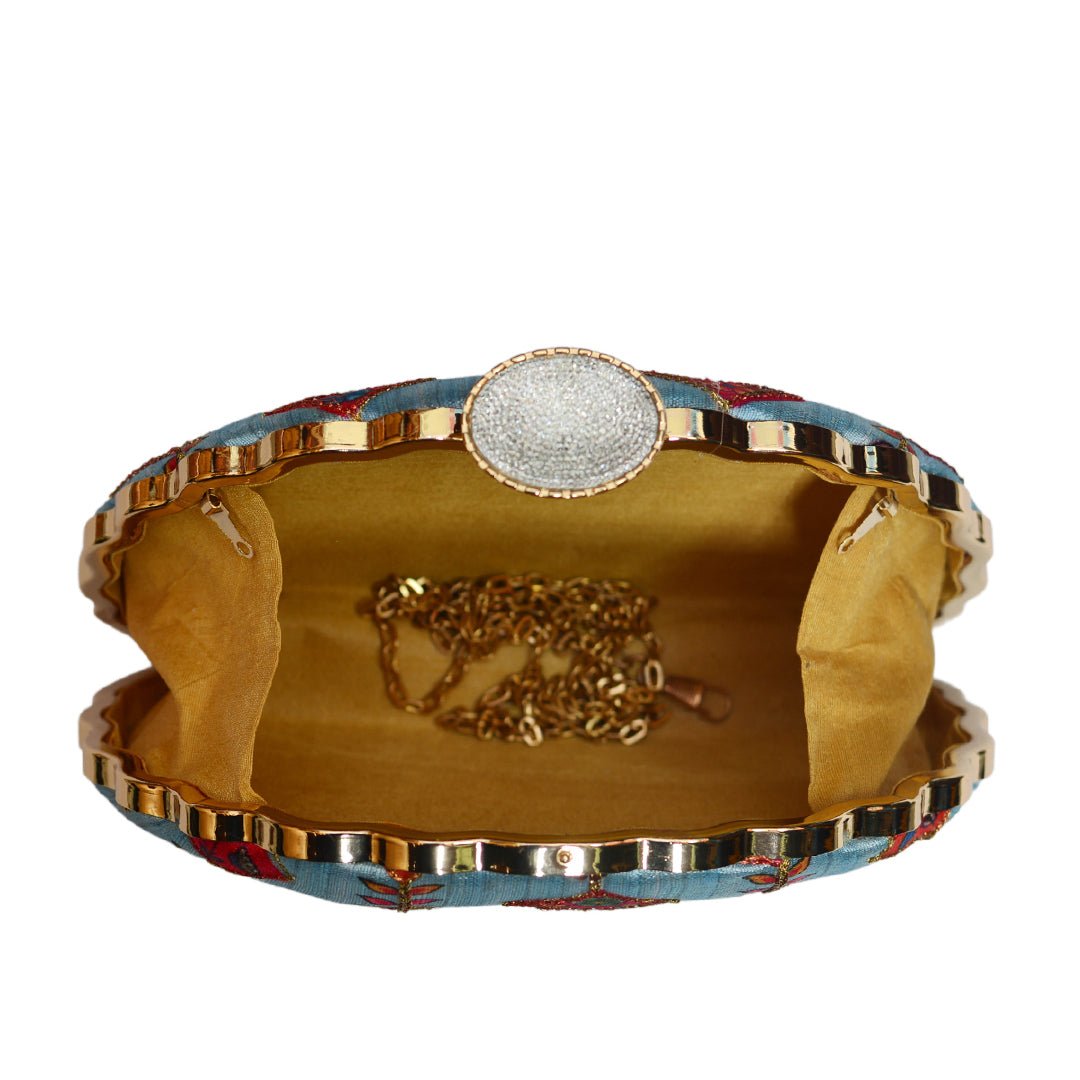 Traditional Motifs on Dreamy Blue Background Clutch