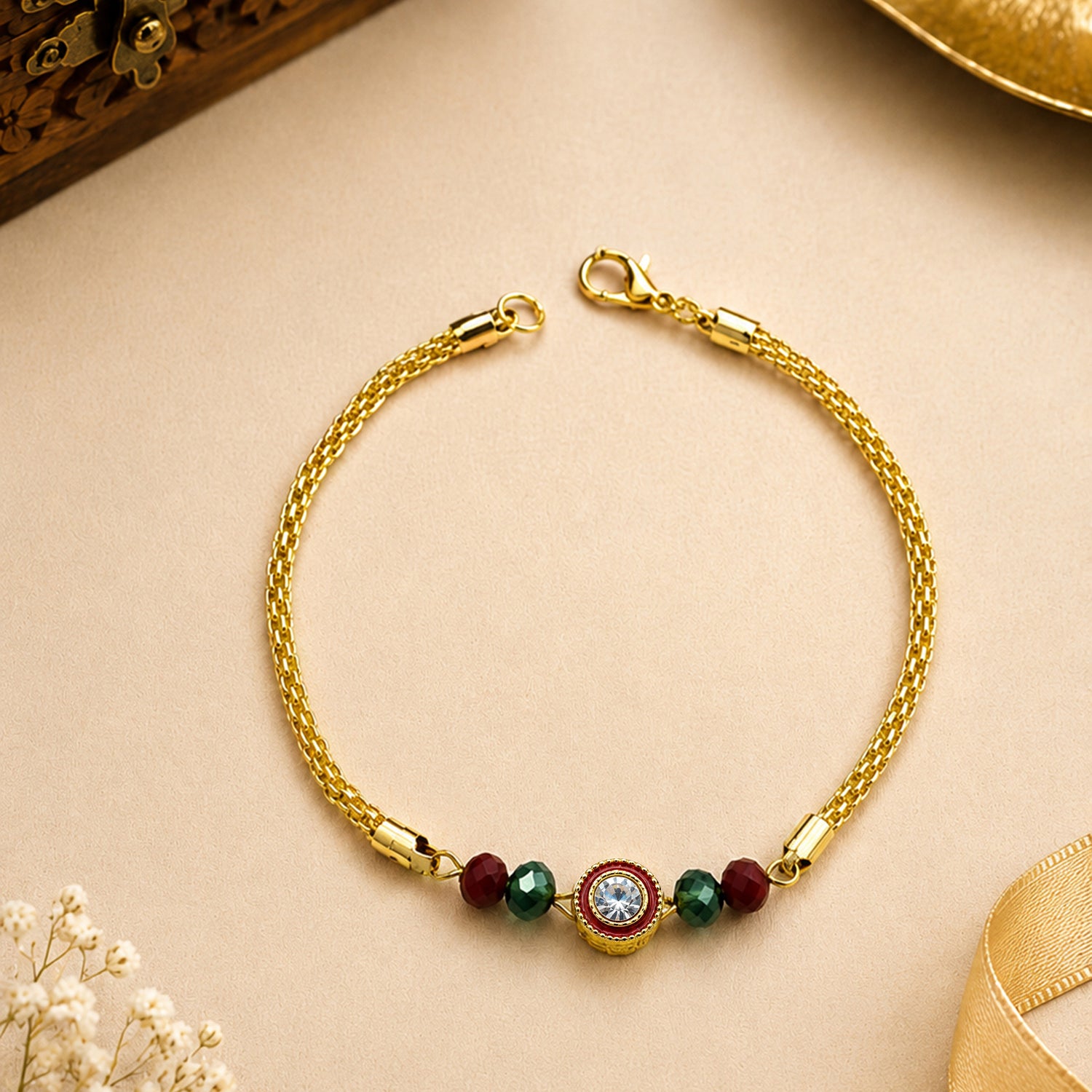 Artklim Luxury Crystal Rakhi with Red & Green Beads for Raksha Bandhan
