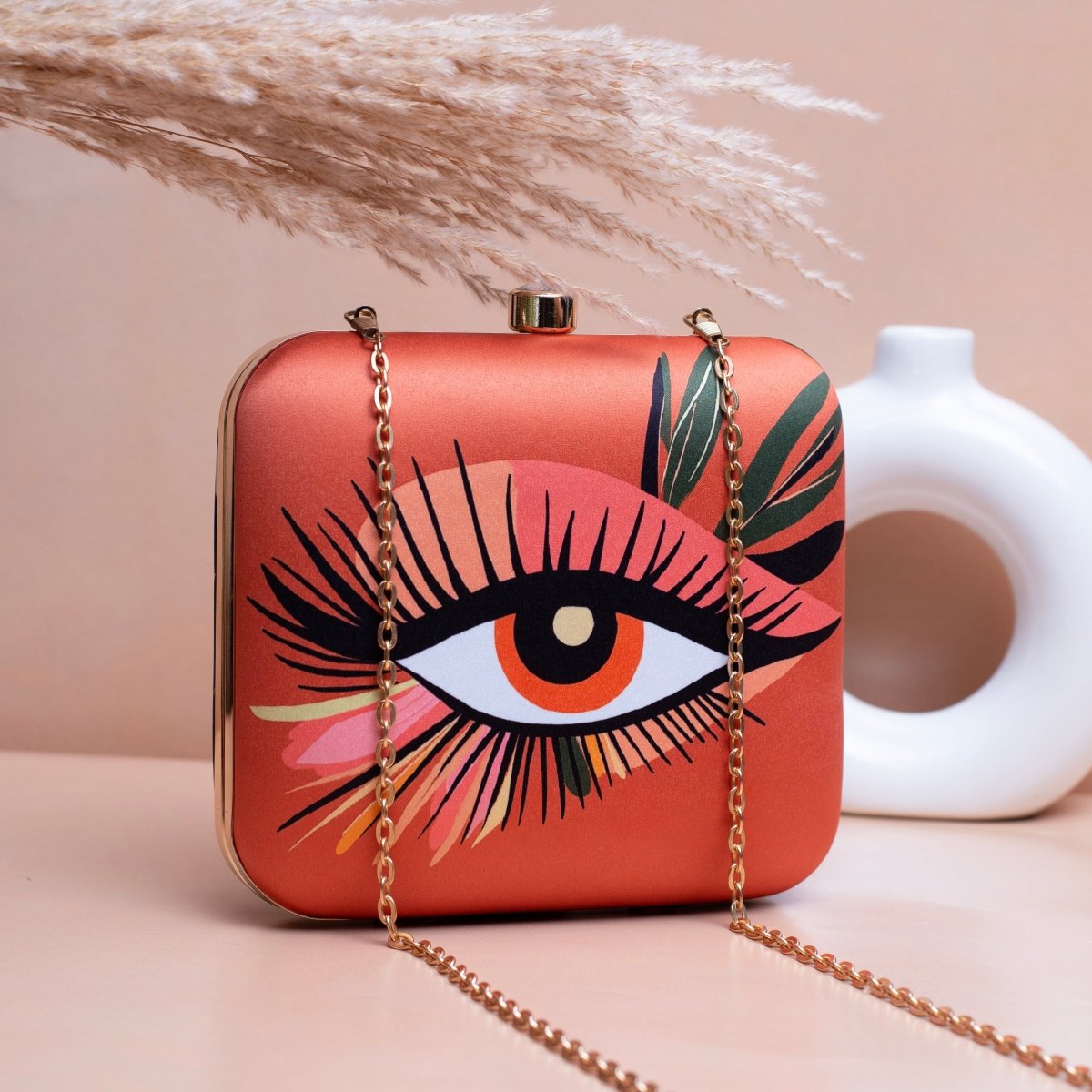 Artklim Orange Based Eye Printed Clutch
