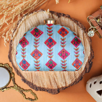 Traditional Motifs on Dreamy Blue Background Clutch